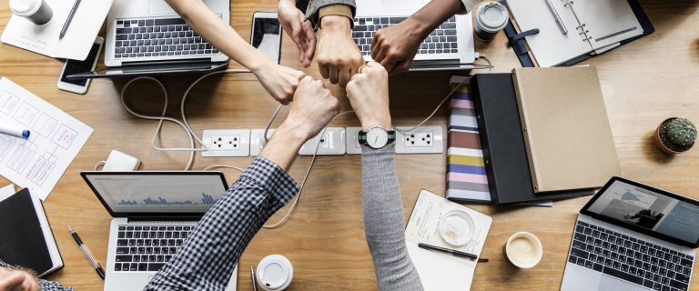 Colleagues giving a fist bump